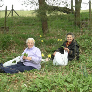 Joy Greenwood and Dorothy Sutcliffe gathering dock leaves
